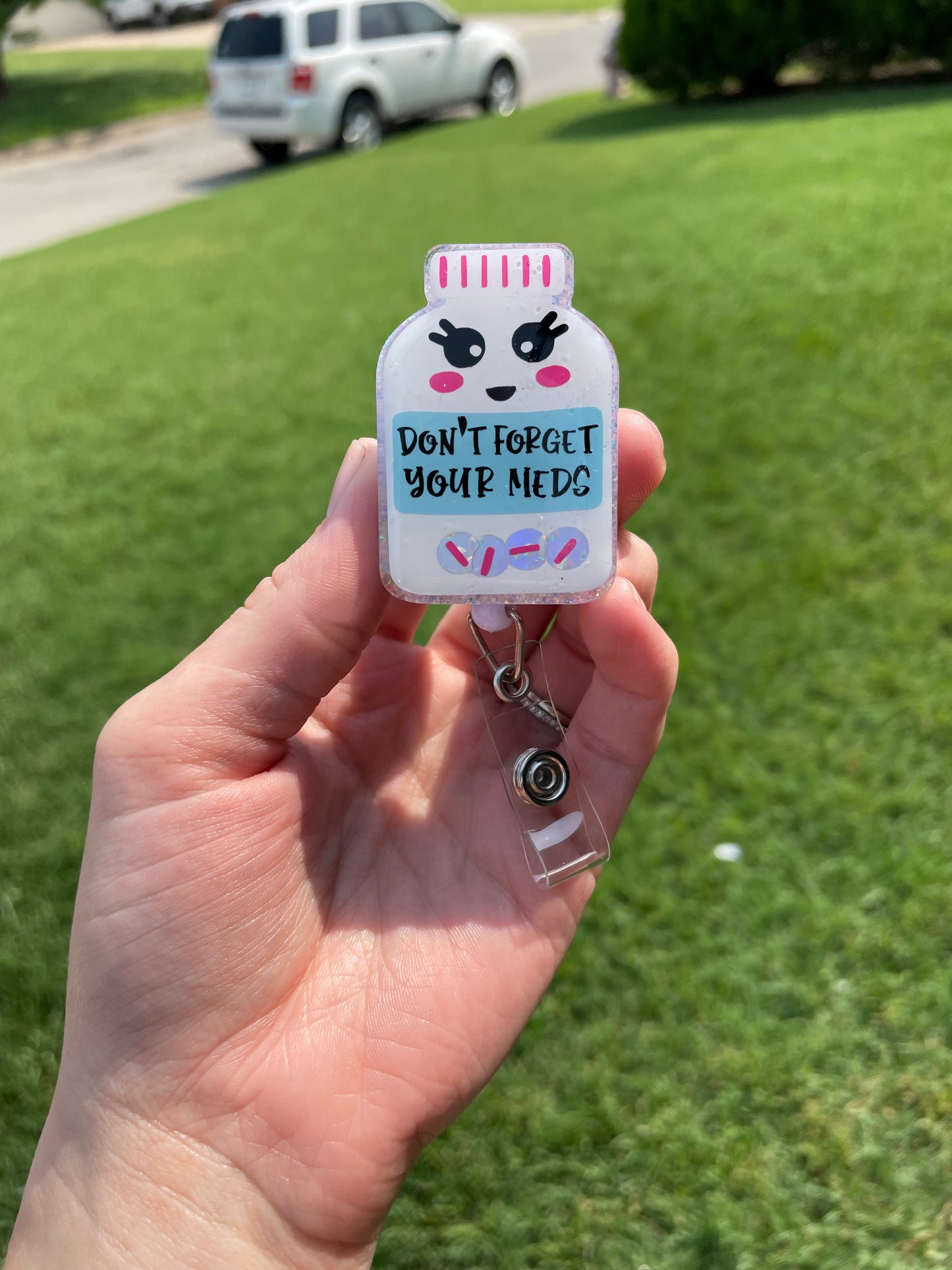 Medicine bottle badge reel