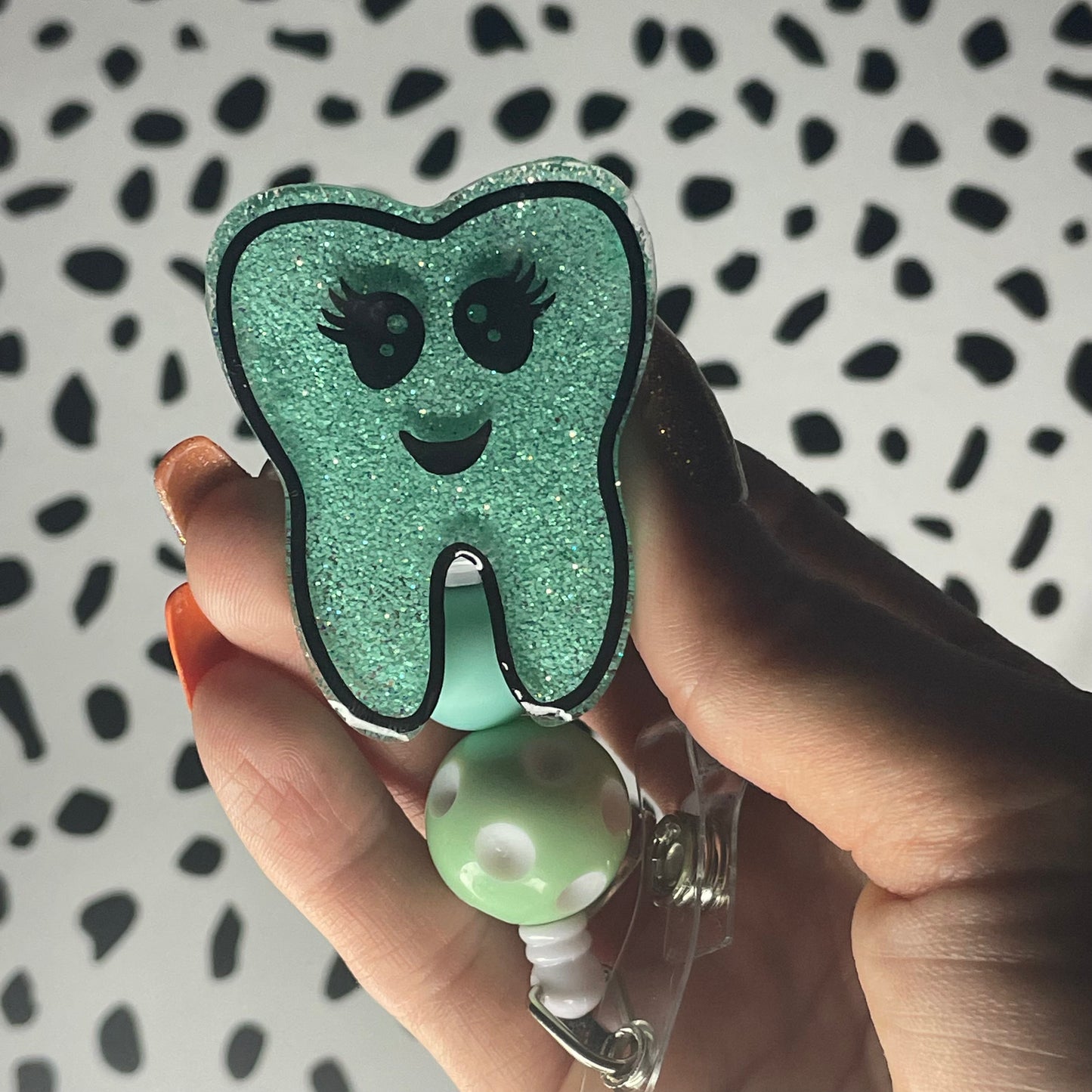 Tooth badge reel